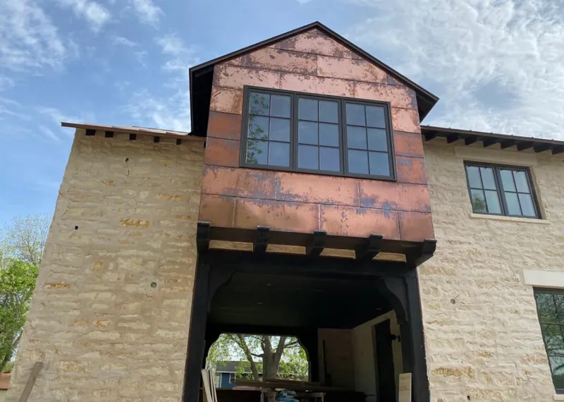 Copper metal panel facade on a stone building for Metal Roof Coating in Mountain Brook